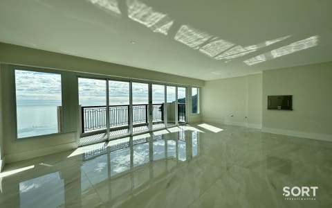Sala de Estar Apartamento Frente Mar no Edifício Aurora Exclusive Home